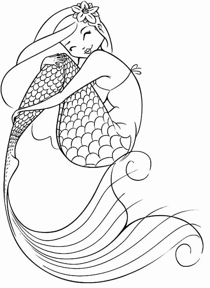 Sereia para colorir: menina sereia abraçando a cauda com flor no cabelo. Imagem para atividades criativas.