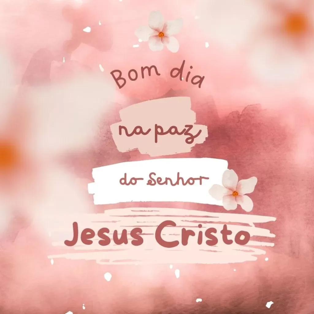 Mensagem religiosa de bom dia com a frase 'Bom dia na paz do Senhor Jesus Cristo' em tons de rosa e branco, adornada com flores brancas.